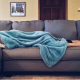 Woman laying on couch after coming home from work.