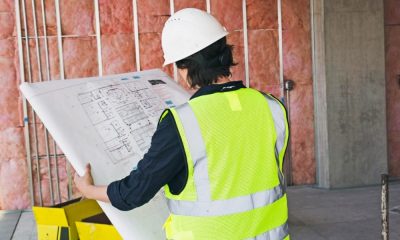 Builder reading master plan for new construction homes