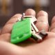 Hand holding keys to homeownership.