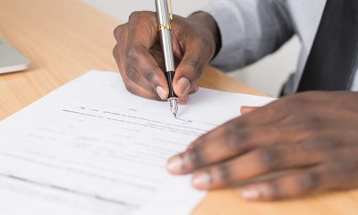 Man signing application may only be seen by automation