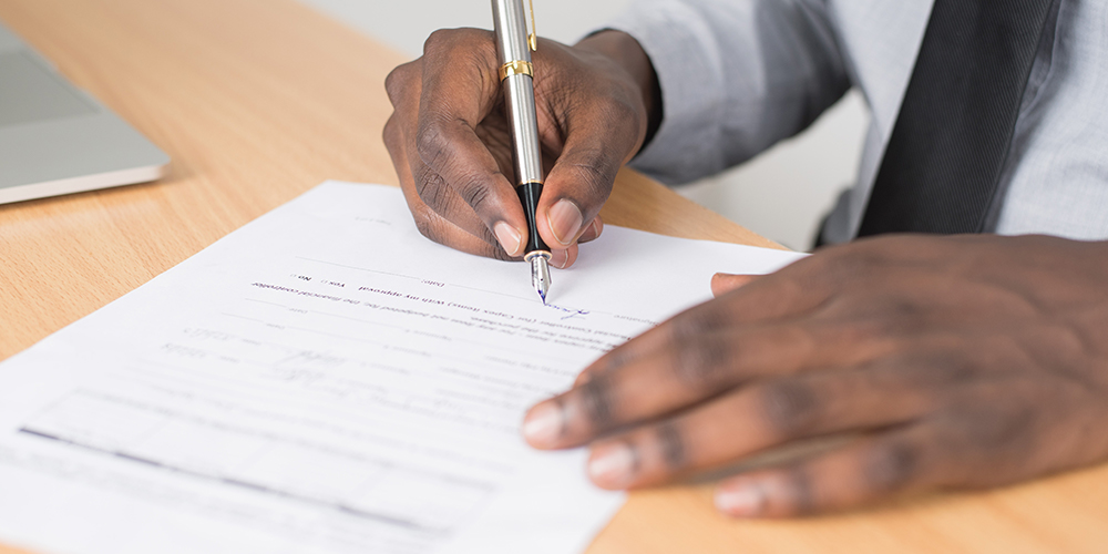 Man signing application may only be seen by automation