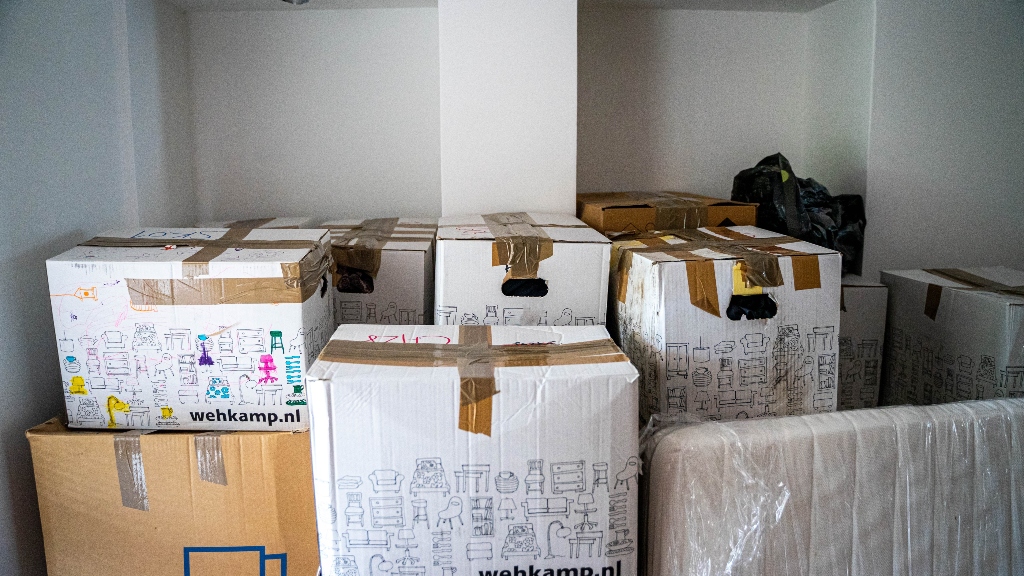 Boxes for moving out of a house representing clutter