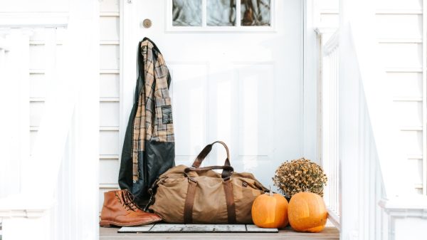Porch with pumpkins and coat, representing fall business