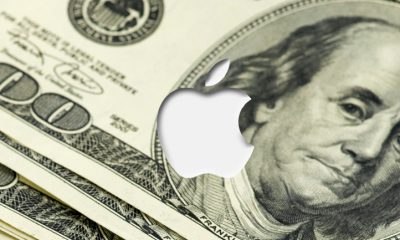 Apple logo on dollar bills representing China deal