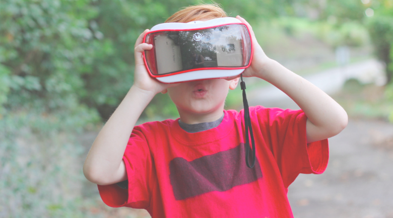 Kid using VR googles representing parenting in a digital world.
