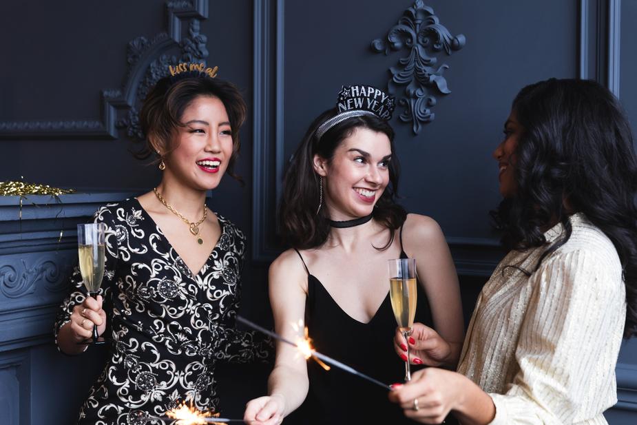 Three women celebrating new years in spite of not keeping their resolutions.