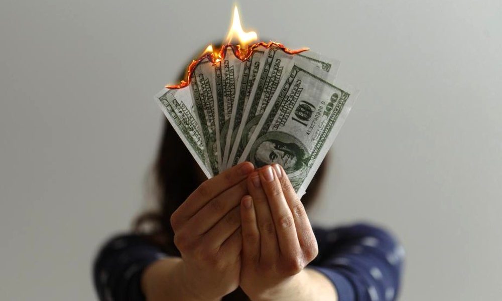 Burning money representing inflation
