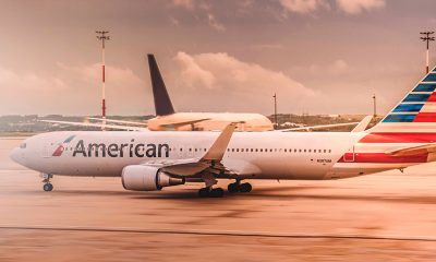 American Airline plane grounded at sunset.