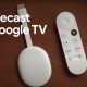 Chromecast with Google TV on a wooden background.