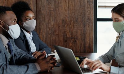 Masked people in meeting, but employers may find it hard to keep safe