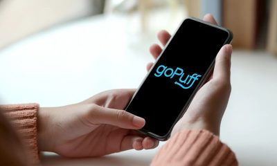goPuff app open on iPhone in woman's hands.
