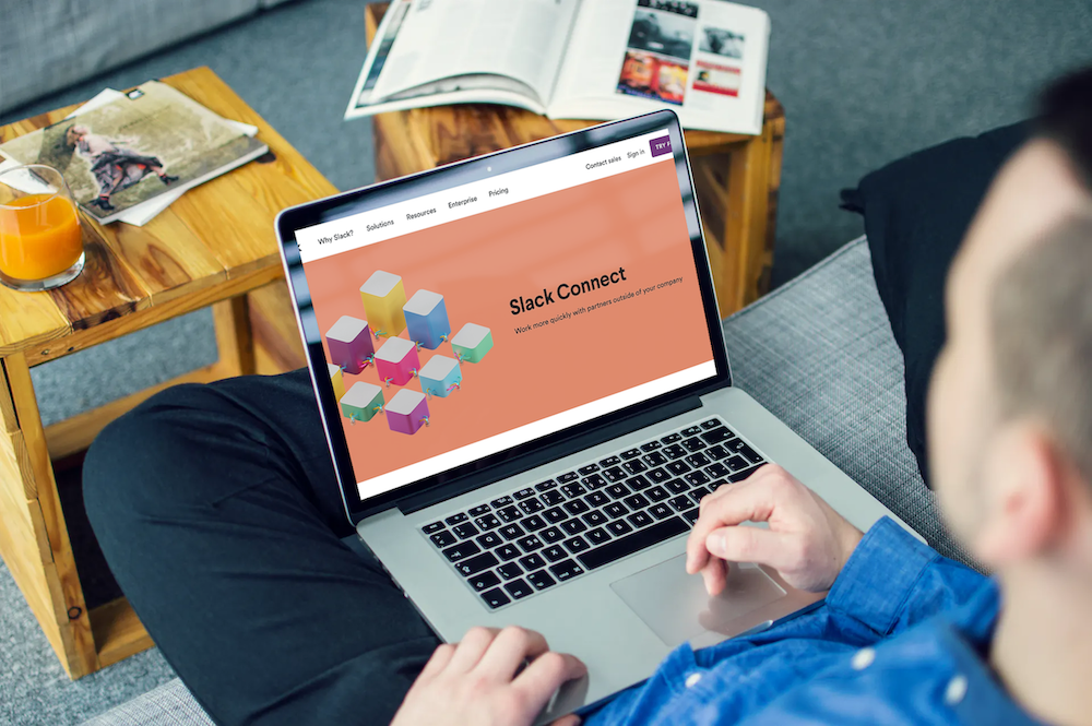 Man looking at Slack Connect home page on laptop