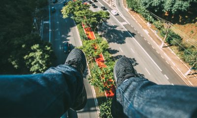 Feet dangling above air, showing a possible future with flying cars