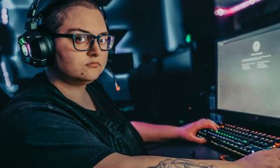 Twitch streamer in front of gaming PC, likely to face DMCA claims.