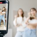 Influencer marketing people taking video on a smart phone to record dances.