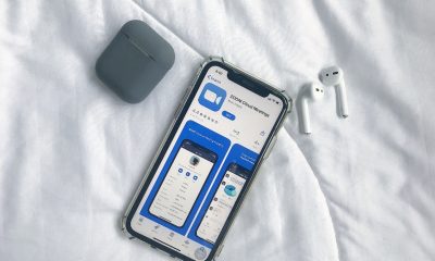Zoom app showing on IOS App store with Apple Airpods.