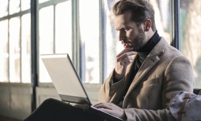 Employee looking confused at computer due to job description phrases
