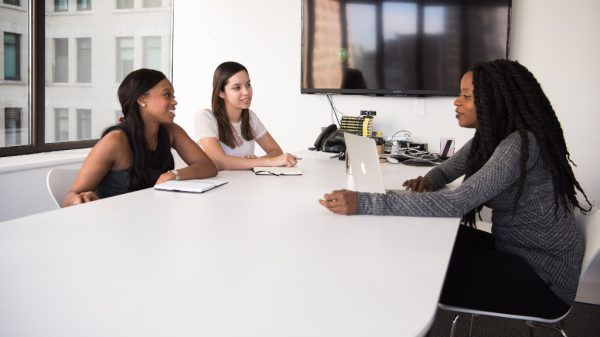 Women talking in a room during the hiring process