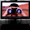 Facebook (Meta) in binoculars on computer