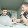 Man teaching younger assistant representing reverse mentorship