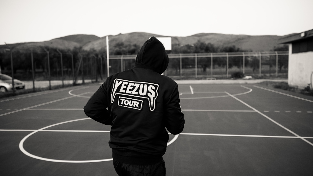 Person wearing Yeezus Tour sweatshirt representing Ye's purchase of Parler