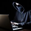 internet scams, image of person perpetrating a phishing scheme