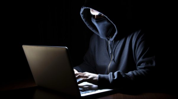 internet scams, image of person perpetrating a phishing scheme