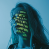 A woman in a blue-lit room with green lines of code projected onto her face for an AI girlfriend.