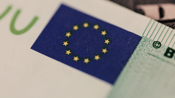 A close up of a stamp of the European Union flag on a paper hinting at the AI Act.