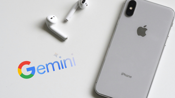 An iPhone with Airpod headphones sitting next to it with the Apple logo facing up and the logo for Google Gemini AI next to it.